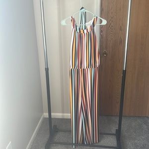 Brand new, tags still on long jumpsuit. 14/16